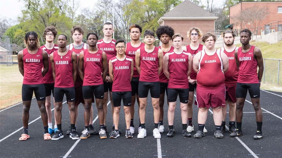 2022-23 ASD boys track & field team in rows on the track at Kiwanis Field.
